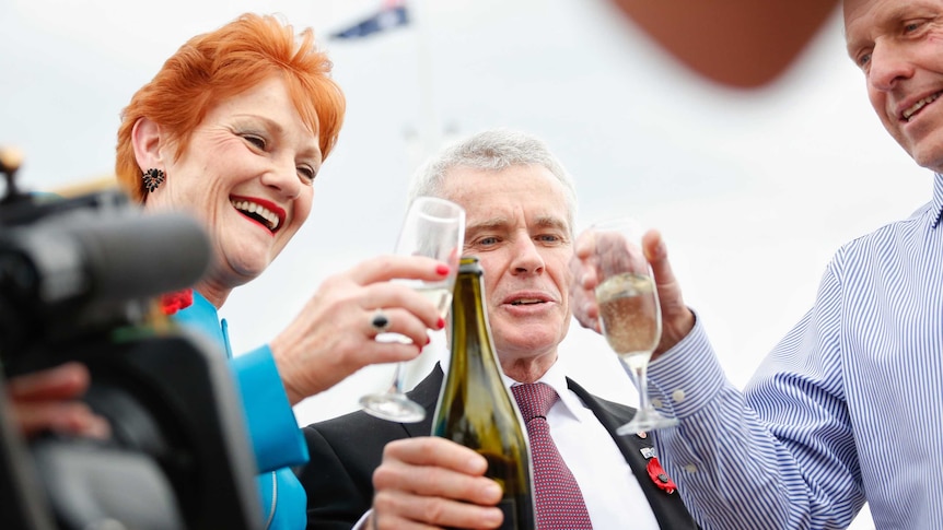 One Nation Senators drink champagne outside Parliament House