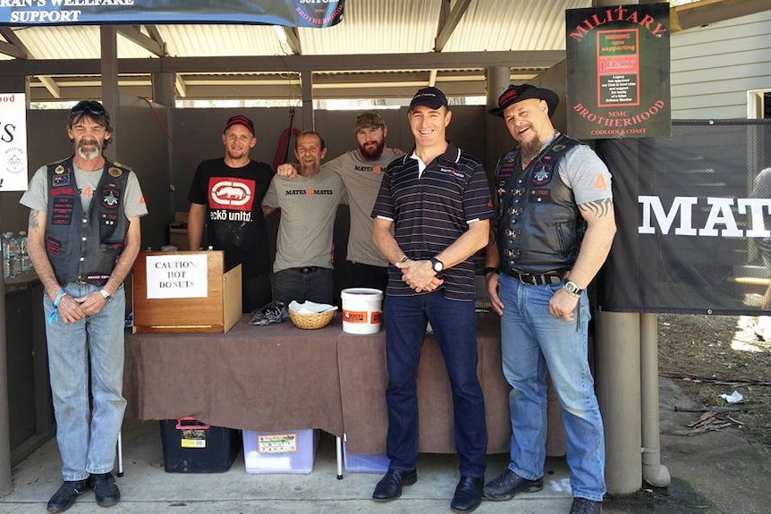 Group of men at donut stall