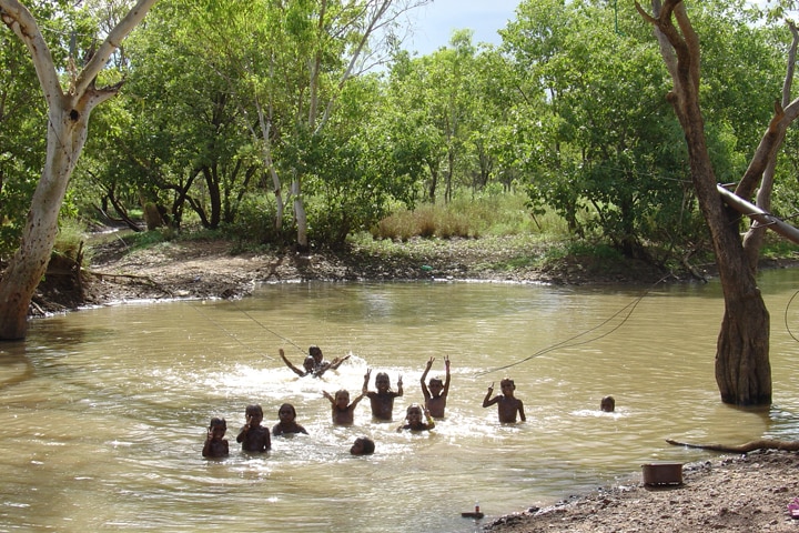Children from Lajamanu Community play in Hooker Creek in the wet season in 2008.