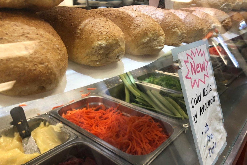 Sandwich ingredients on display in glass counter