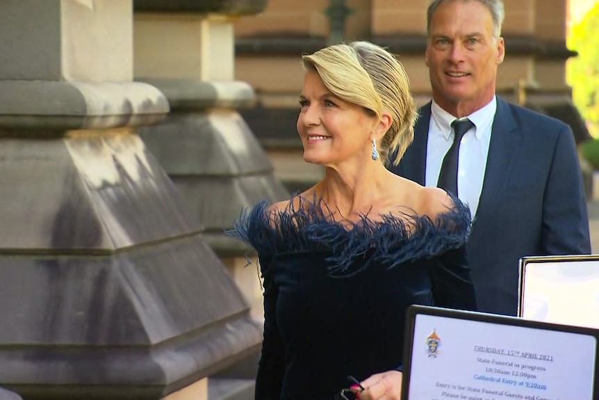 A woman smiling outside of church