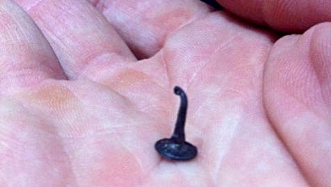 One of the tacks thrown onto the road and into the path of the Tour de France peloton.