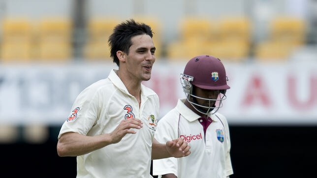Mitchell Johnson celebrates the wicket of West Indian batsman Denesh Ramdin.