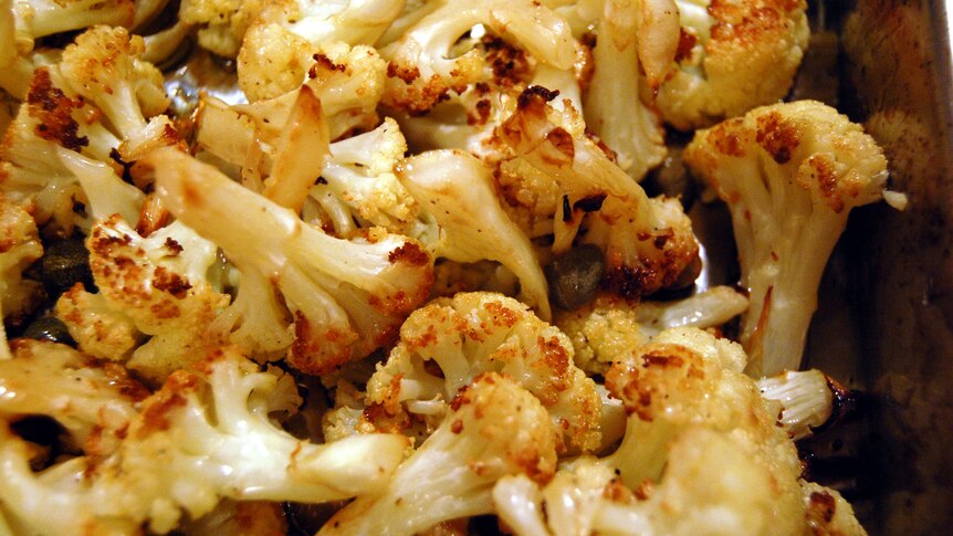 Close up on roasted cauliflower covered with spices.