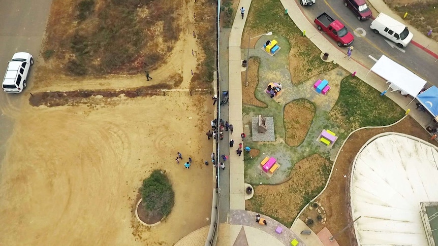 Border fence separating San Diego in the US, left, from Tijuana, Mexico, right.