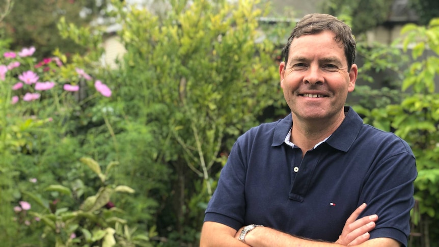 Oliver Yates, Independent candidate for Kooyong standing in front of some plants