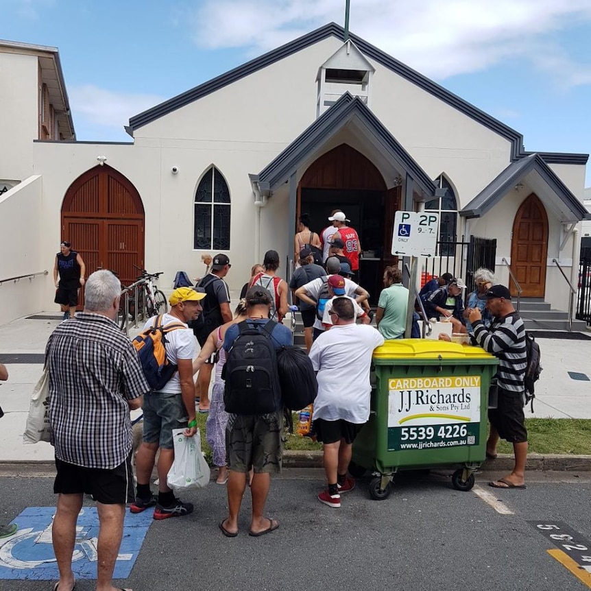 People line-up at the soup kitchen at St John's Crisis Centre in Surfers Paradise