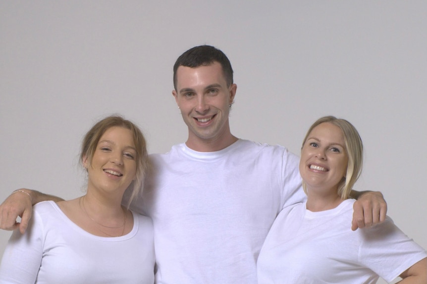 Maddie, James and Victoria all wearing white T-shirts.