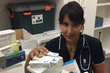 Dr Nalini Rao with boxes of medicines