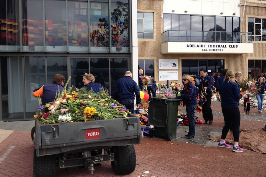 Flowers being removed at Football Park