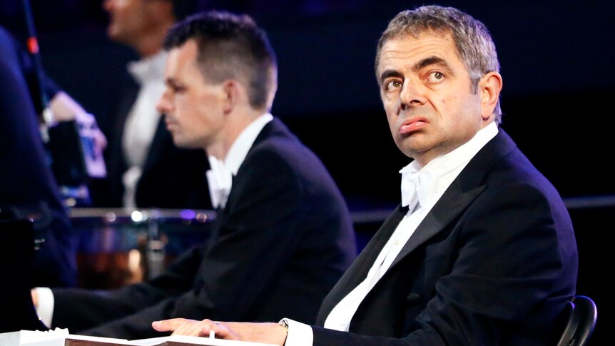 Actor Rowan Atkinson, playing Mr Bean, performs during the opening ceremony.