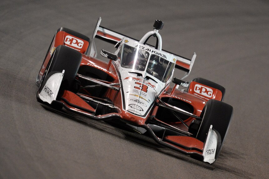 Scott McLaughlin drives his IndyCar on a banked corner