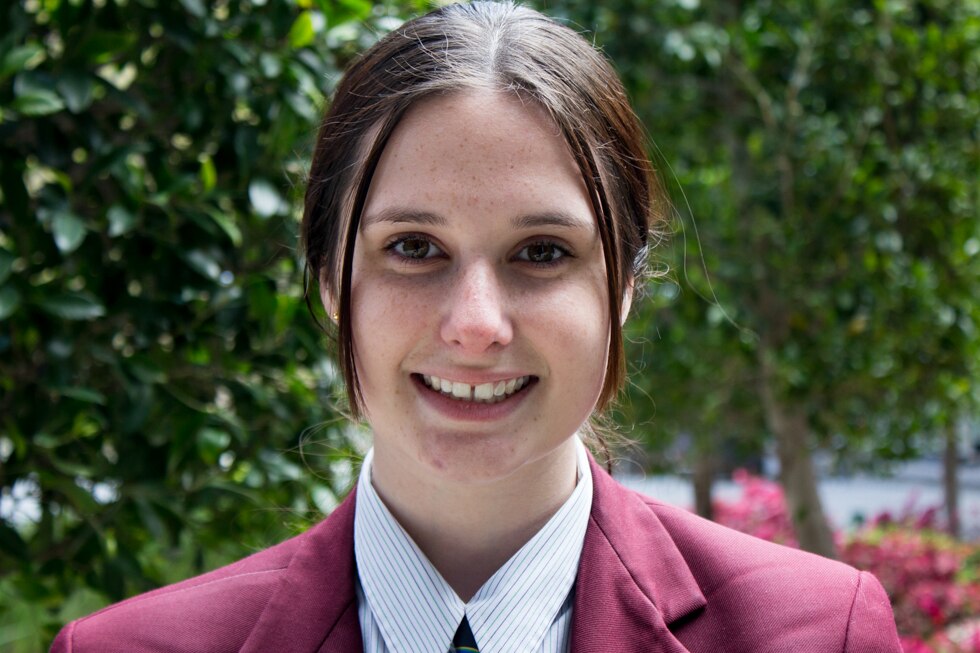 A teenage girl in school uniform