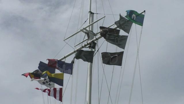 Ship mast with many nautical flags