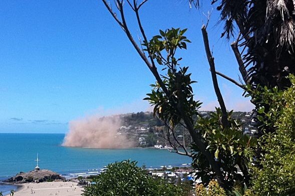 Dust rises from seaside cliffs near Christchurch.