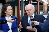 Georgina Downer and John Howard talk to reporters
