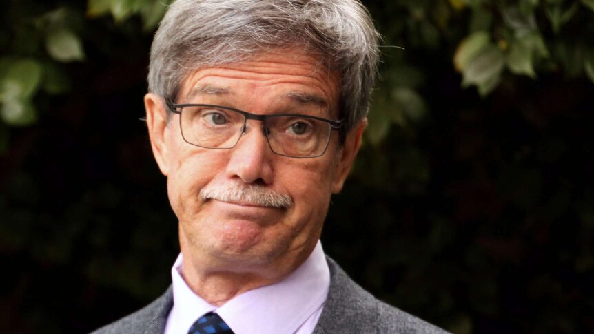 A tight head and shoulders shot of WA Opposition Leader Mike Nahan frowning.