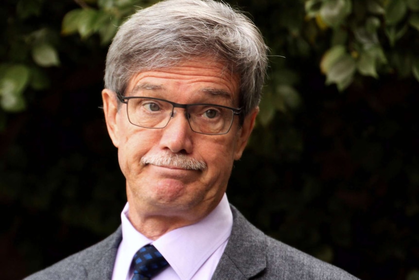 A tight head and shoulders shot of WA Opposition Leader Mike Nahan frowning.