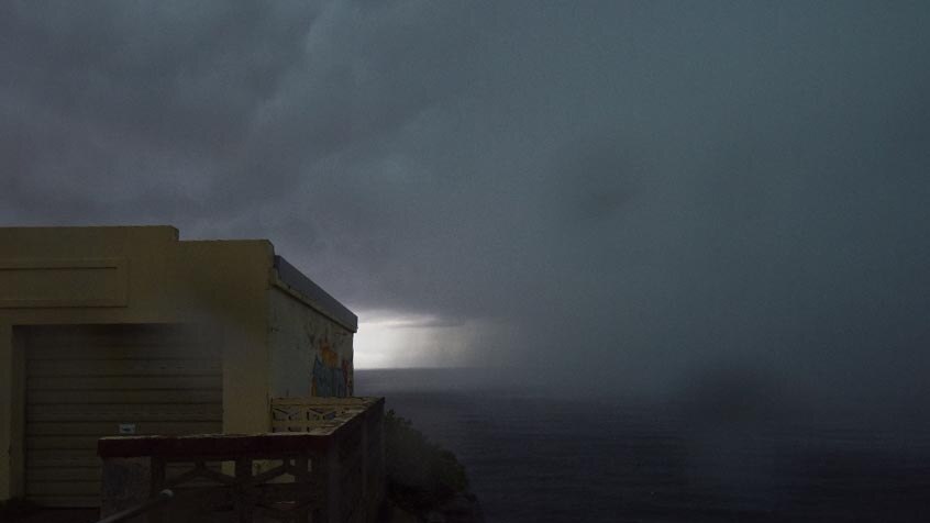 A storm closes in over the ocean off Bondi Beach.