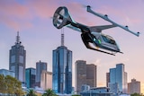 A digital image shows a drone-style helicopter flying over Melbourne's Yarra river.