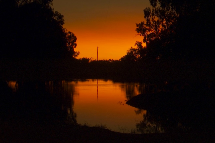 The sun rising over the Darling River at Marra Station, south of Tilpa. 