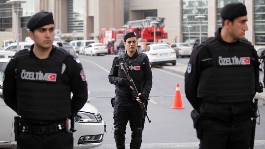 Turkish riot police stand guard