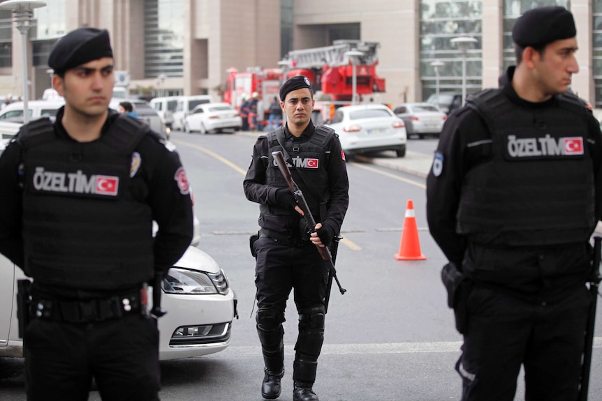 Turkish riot police stand guard