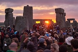 Revellers watch sunrise at Stonehenge