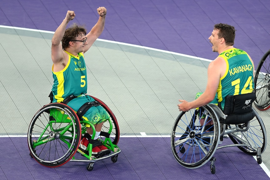 Lachlin Dalton and Jake Kavanagh of Australia celebrate.  Both are pictured in their wheelchairs, Dalton with his arms in the air