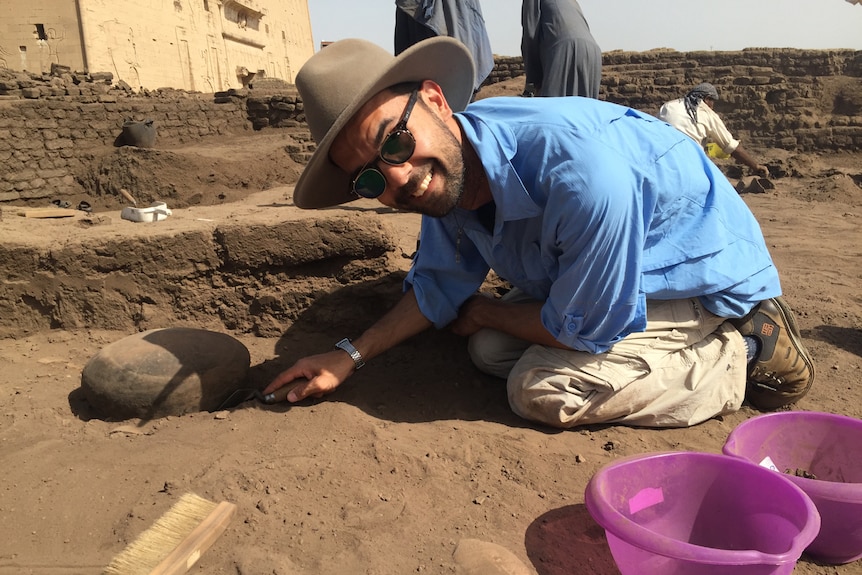 Australian archaeologist Dr Aaron de Souza digging at the Tell Edfu excavation site in Southern Egypt