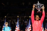 Rafael Nadal holds aloft the US Open trophy