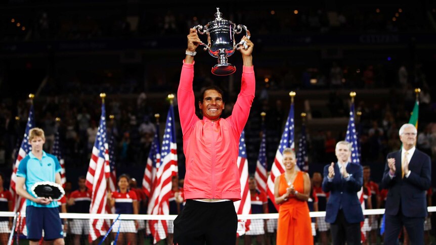 Rafael Nadal holds aloft the US Open trophy