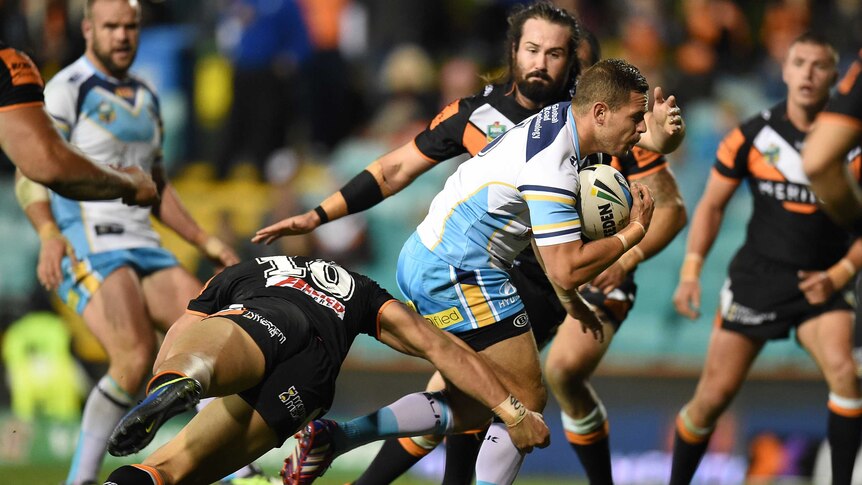 Aidan Sezer held up by Tigers defence
