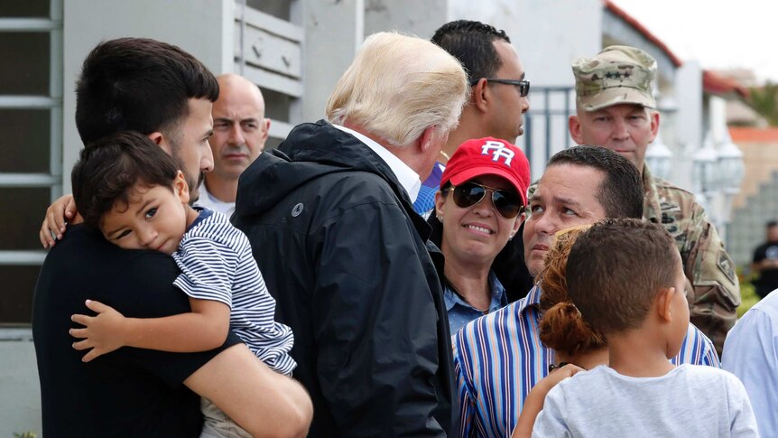 US President Donald Trump talks with residents in San Juan Puerto Rico.
