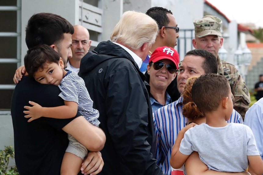 US President Donald Trump talks with residents in San Juan Puerto Rico.