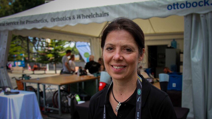 Wheelchair technician Amy Bjornson smiling at the camera.