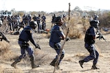Police react after firing at protesting miners in South Africa