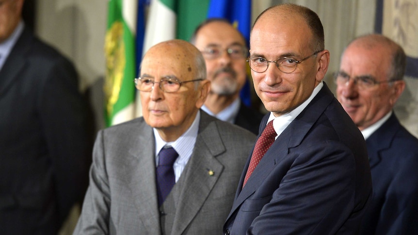 Italian prime minister-designate Enrico Letta (R) announces new government