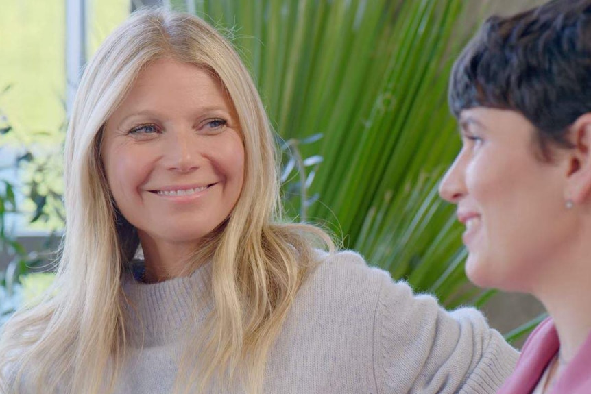 Gwyneth Paltrow and Elise Loehnen mid-conversation during episode one of The Goop Lab.