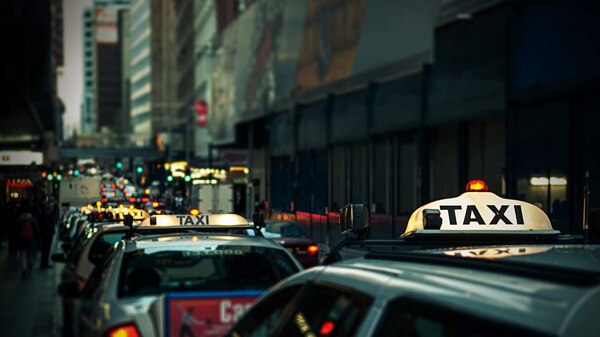 A row of taxis in a city street