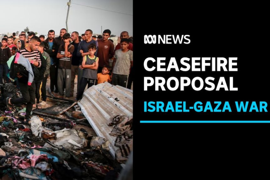 Ceasefire Proposal, Israel-Gaza War: People stand around a damaged scene while a man gathers up clothes.