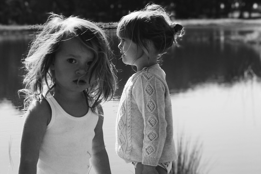 Jayde Couldwell's two children play at a lake.