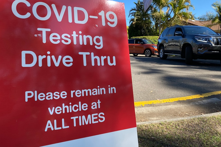 A sign at a COVID-19 testing facility requesting drivers stay in their vehicles.