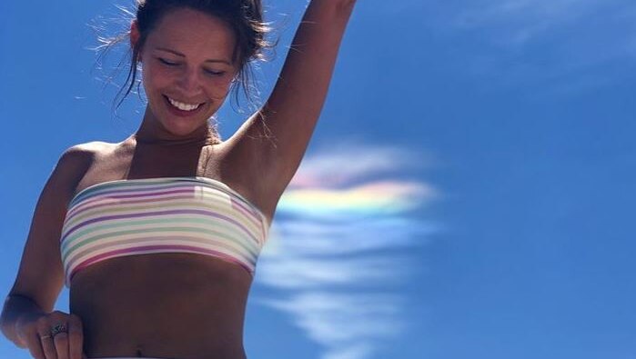 Instagrammer Kimberly Nicole's photo of cloud iridescence which matched her bathing suit.