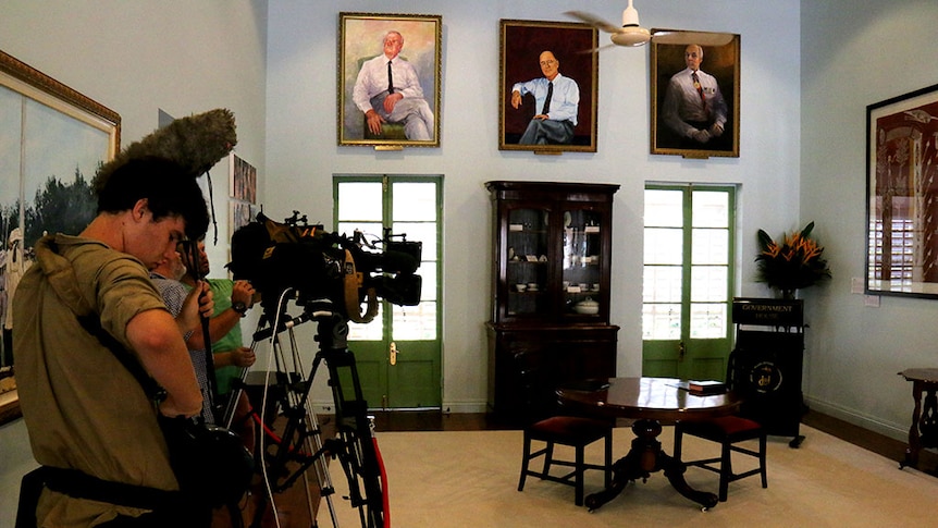 Media wait for a ceremony at Government House in Darwin