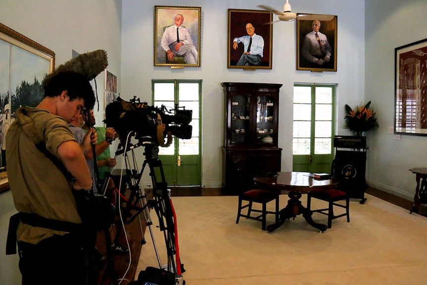 Media wait for a ceremony at Government House in Darwin