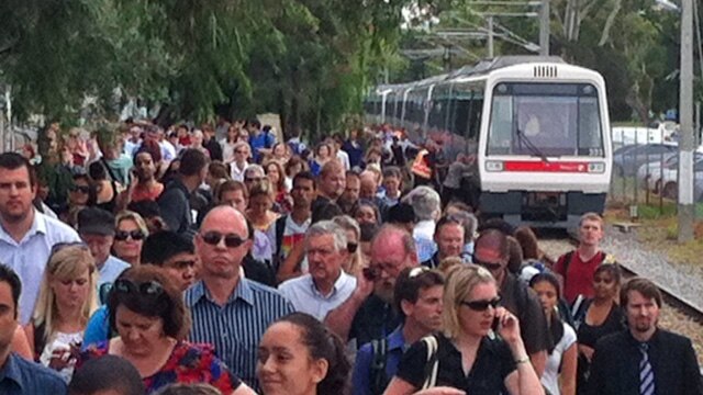 Passengers disembark from stranded train