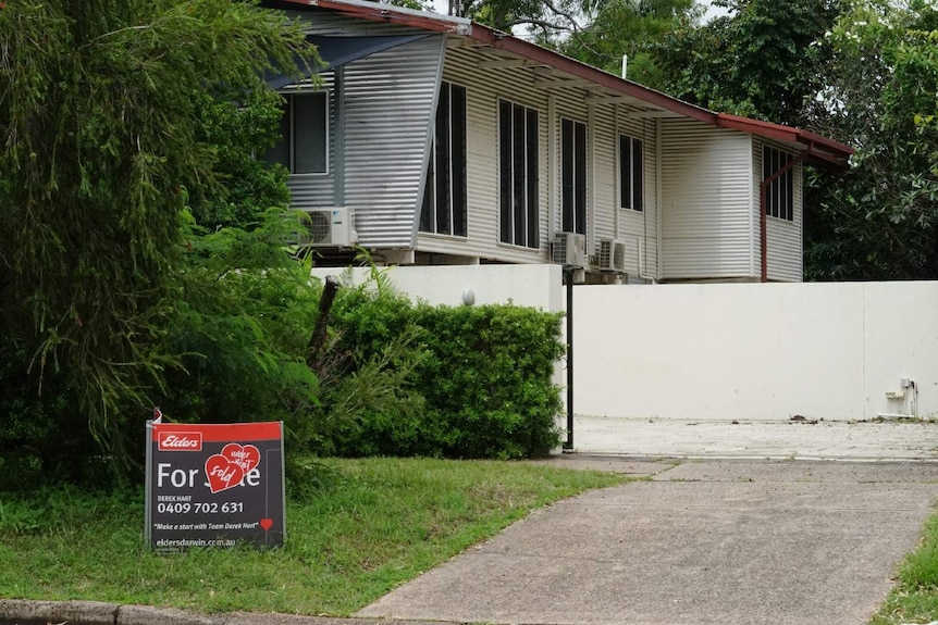 A sold sign sits outside a tropical house in Darwin's suburbs.