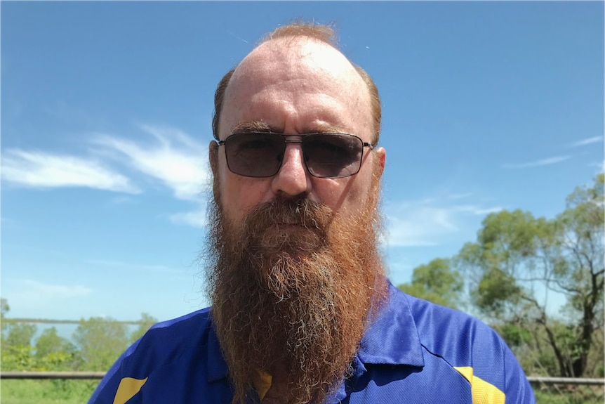 Man with long beard wear blue shirt