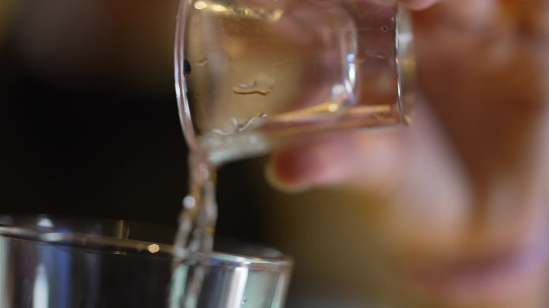 A shot being poured into a drink - ABC News